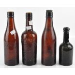 Four early 20th century glass bottles, two marked 'Lovibond & Sons' and one 'Whitbread',