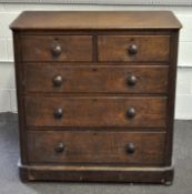 An early 20th century stained chest of drawers with two short over three long drawers,