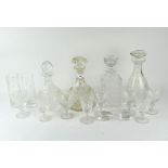 A collection of cut glassware including four decanters and various glasses,