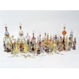 A large collection of contemporary glass scent bottles, of assorted colours and designs,