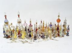 A large collection of contemporary glass scent bottles, of assorted colours and designs,