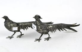 A pair of silver plated pheasants, standing in naturalistic poses,