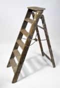 A patented Simplex ladder, the pine five-height ladder with metal mounts,