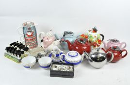 A collection of novelty ceramics, comprising teapots modelled as strawberries,