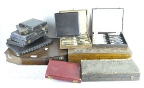 Two oak canteens for cutlery and a number of vintage boxes of silver plated fish and other cutlery,