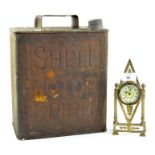 A 'Shell Motor Spirit' oil canister and a small gilt metal clock, height of oil canister 31cm,