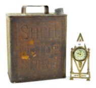 A 'Shell Motor Spirit' oil canister and a small gilt metal clock, height of oil canister 31cm,