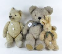 A group of three vintage soft toys, two being bears,