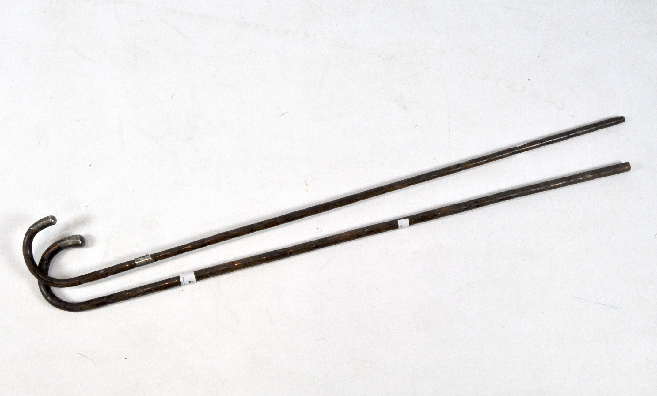 Two late 19th/early 20th century walking canes,