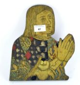 A wooden plaque depicting a praying figure, his robe decorated with crests,