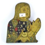 A wooden plaque depicting a praying figure, his robe decorated with crests,