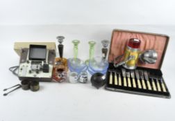A group of assorted collectables to include cased vintage flatware, candlesticks, lamp,