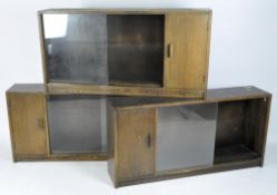Three 20th century oak veneered glazed bookcases,