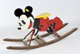 A child's ride-on rocker, the structure painted as and modelled in the shape of Mickey Mouse,