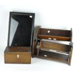 A group of vintage wooden items, including a tea chest, wall display case, book rests and book end