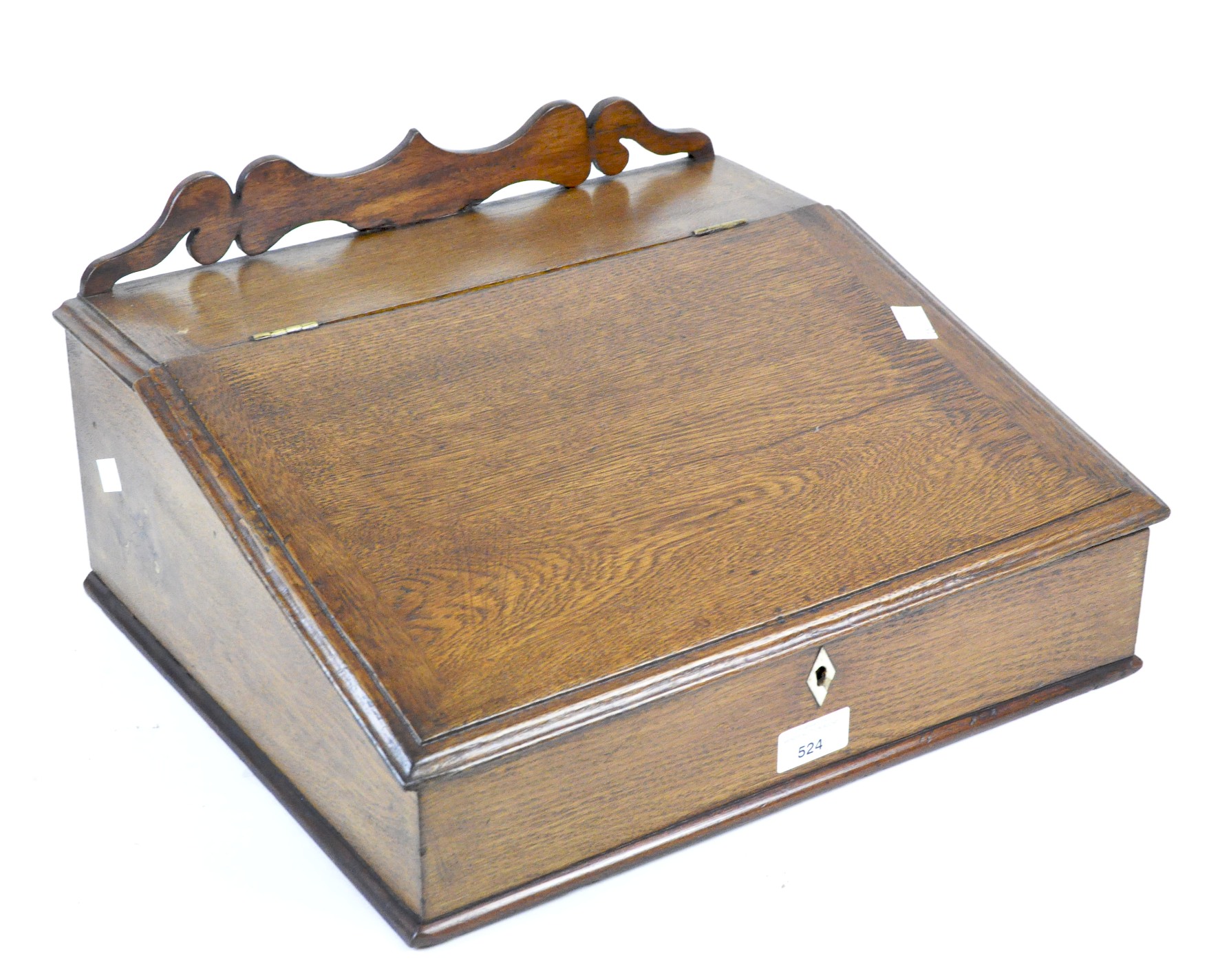 An early 20th century oak table top writing slope,