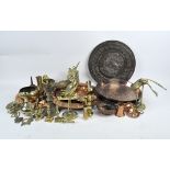 A collection of mixed brass and copper, including five chargers, horse brasses, candlestick holders,