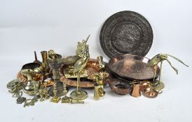 A collection of mixed brass and copper, including five chargers, horse brasses, candlestick holders,