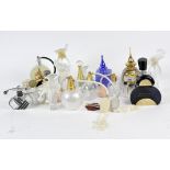 A large collection of assorted perfume bottles, mostly glass,
