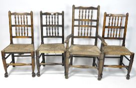 Four rattan based dining chairs, all with stained oak structures, turned spindles and supports,
