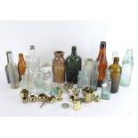 A collection of vintage glass bottles together with stoneware storage jars and more
