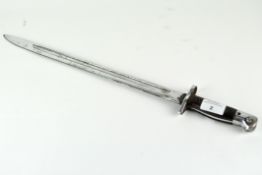 A mid-20th century bayonet with wooden handle