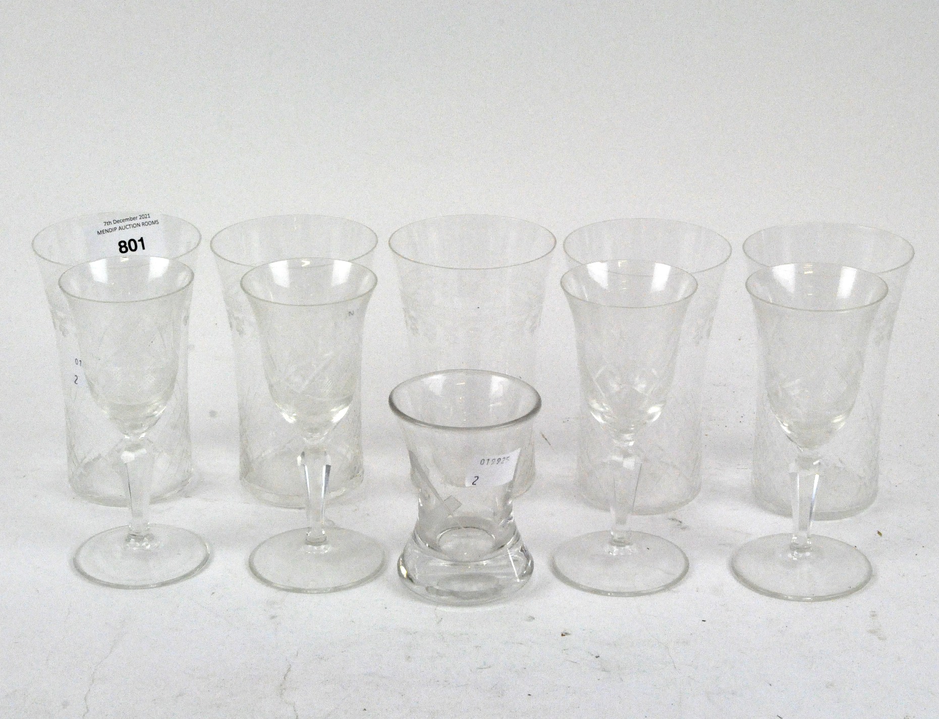 A selection of glassware, including four cut glass aperitif glasses with engraved decoration,