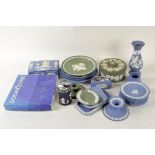 A collection of Wedgwood jasperware, in blue and green, including a lidded pot, cigarette lighter,