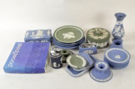 A collection of Wedgwood jasperware, in blue and green, including a lidded pot, cigarette lighter,