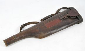 A vintage mutton leg gun case, the leather case with metal fastenings and catches,