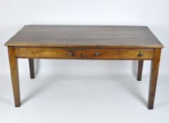 An early 20th century mahogany dining table of rectangular form, with two long drawers to one side,
