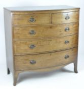 A Georgian bow front chest of drawers, with two short drawers above three long graduated drawers,