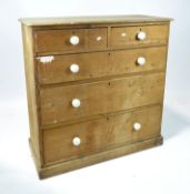 A Victorian pine chest of drawers, two short drawers above three longer ones,