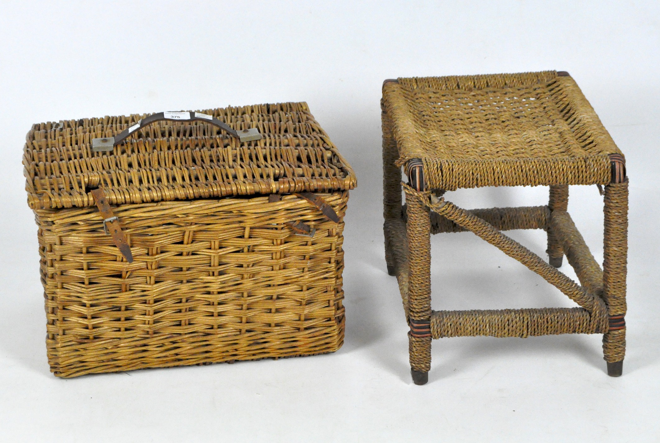 A wicker stool and hamper,