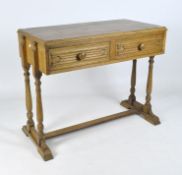 An early 20th century oak console table, raised upon turned supports with splayed feet,