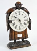 A contemporary carved wooden clock, the white dial with Roman numerals,