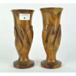 A pair of Pitcairn Island wooden vases, both carved as hands holding a fluted glass, height 20.