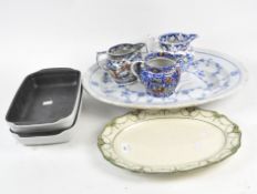 A group of ceramics including two ceramic meat plates, the largest being a turkey plate,