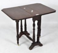 A Victorian mahogany gateleg table, with turned supports,