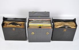 Three carry cases of vintage vinyl singles and albums,