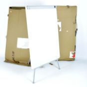 Two flip chart easel boards, with three leg support to rear,