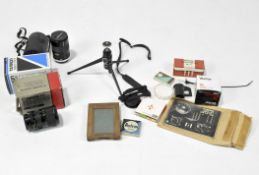 A collection of camera lenses and accessories, including a boxed Canon 35-70 zoom lens,