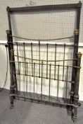 A Victorian iron and brass bedstead, painted in black with brass details,