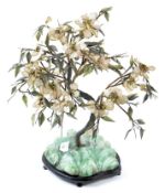 A Chinese export quartz and stone cherry blossom bonsai tree, in a fitted wood base,