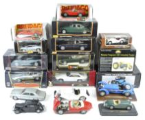 A large collection of model cars by Maisto, Saico, Burago, and others, including an E-type Jaguar,