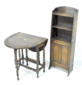 A 20th century mahogany bookcase and drop leaf table,