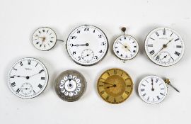 A collection of eight vintage pocket watch movements with dials,