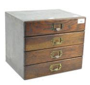 A vintage East Light tabletop chest of drawers, comprising four drawers,