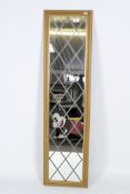 A late 20th century wall mirror, of rectangular form and within a wooden case,