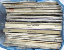 A collection of vinyl records, including works by Jim Reeves, The Seekers and Andy Williams,